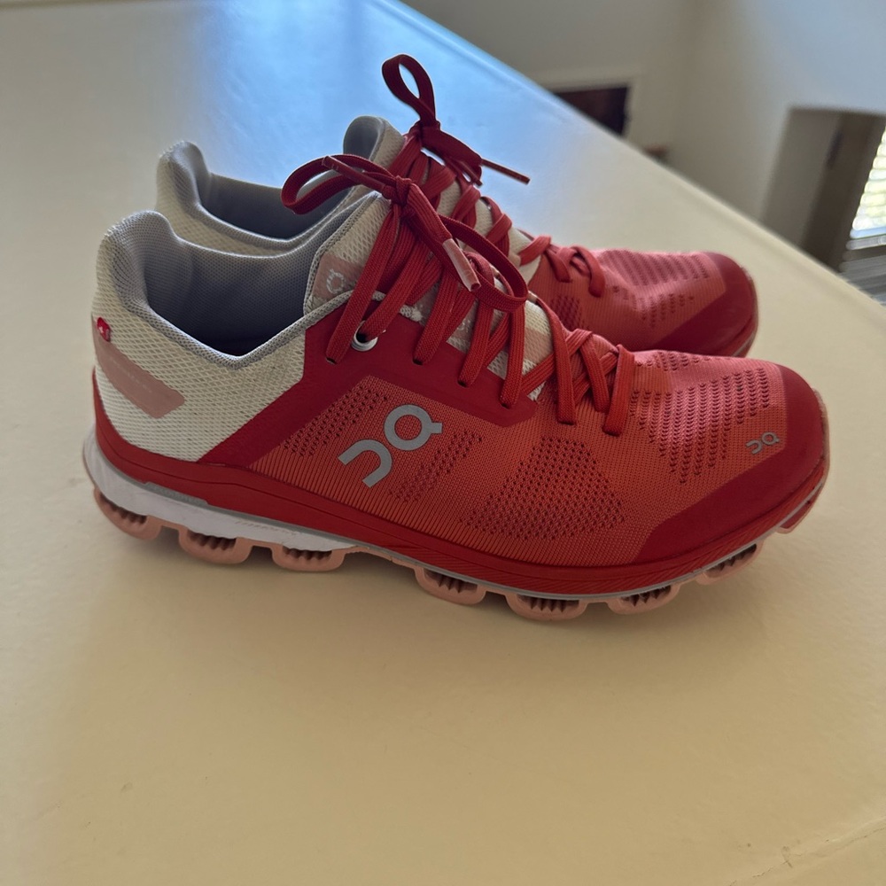 On Running Coral and White Athletic Shoes